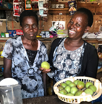 Two business owners in market
