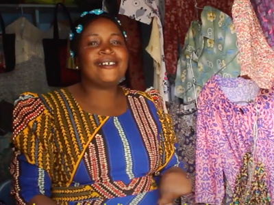 east african woman sells fabric