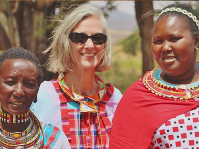WMI President, Robyn Nietert pictured with two microfinance recipients in Eastern Uganda