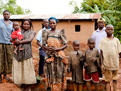 Family Matriarch With Mud Hut