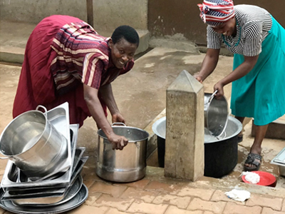 Two African Women Getting Clean Water