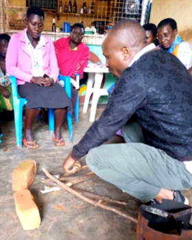 The staff of Sun24 graciously volunteered their time and expertise to show women in our loan hubs how to use simple metal grates beneath their 3-stone cook stoves
